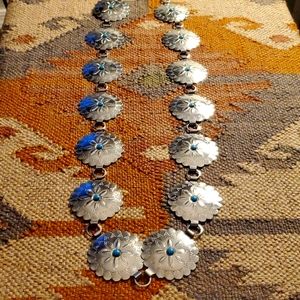 Southwestern style belt. Silver color, faux turquoise accents.